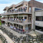 People standing on a balconies.