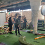 People playing mini-golf