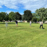 People playing disc golf